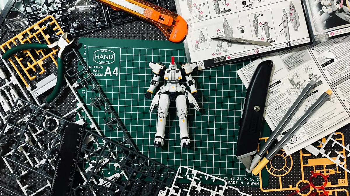Gundam model and ABS plastic sprue used for assembling model kit parts