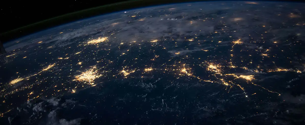 Looking down at the night of the earth from outer space, the lights converge