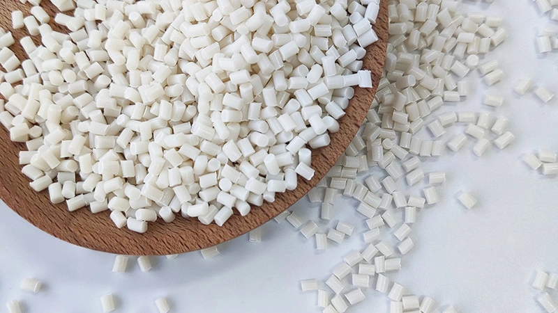 High-quality white starch-based modified pellets, showcasing premium biodegradable resin for PLA and PBAT blending.