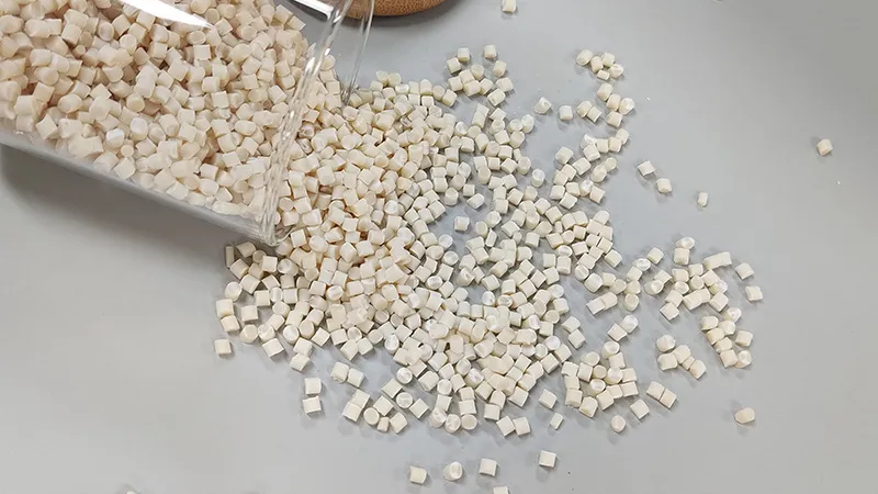 modified PLA and PBAT biopolymer resin pellets, illustrating sustainable raw material for manufacturing.