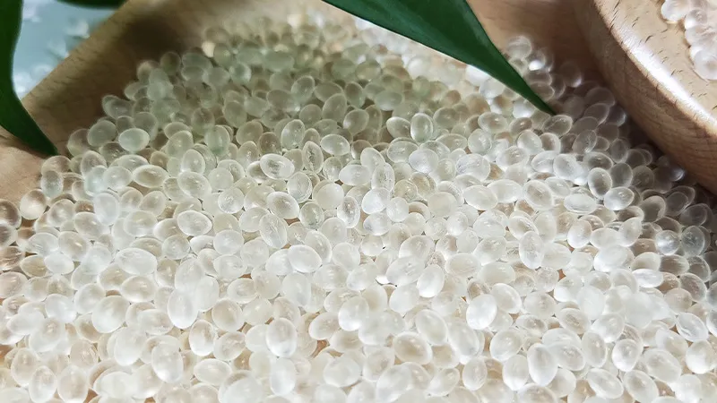 Transparent biodegradable resin granules for eco-friendly plastic manufacturing.