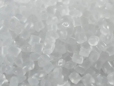 Nylon (PA) pellets, such as PA6 or PA66, in cylindrical or oval shapes, in natural color, translucent yellow, white, or ivory-white.